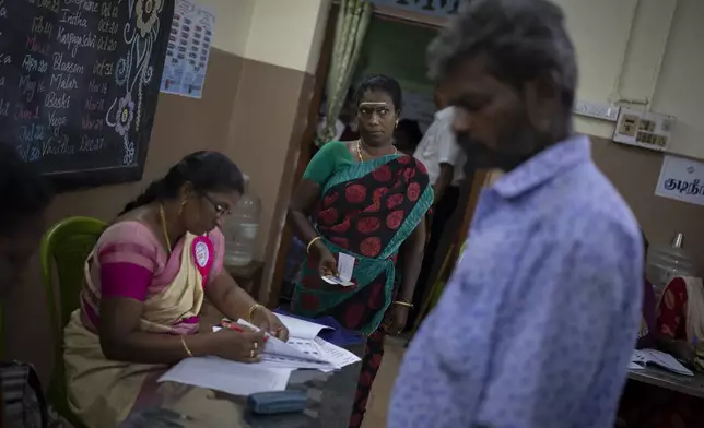 People arrive to vote during the first round of voting of India’s national election in Chennai, southern Tamil Nadu state, Friday, April 19, 2024. Nearly 970 million voters will elect 543 members for the lower house of Parliament for five years, during staggered elections that will run until June 1. (AP Photo/Altaf Qadri)
