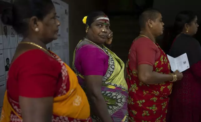 Women queue up to cast their votes during the first round of polling of India’s national election in Chennai, southern Tamil Nadu state, Friday, April 19, 2024. Nearly 970 million voters will elect 543 members for the lower house of Parliament for five years, during staggered elections that will run until June 1. (AP Photo/Altaf Qadri)