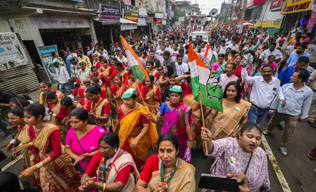Women supporters of the Congress party campaign for the upcoming national elections in Titabor in upper Assam, India, Tuesday, April 16, 2024. (AP Photo/Anupam Nath)
