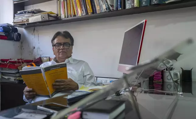 Lawyer Mihir Desai poses for a photograph at his office in Mumbai, India, April 3, 2024. Desai is defending a dozen political activists, journalists and lawyers jailed in 2018 on accusations of plotting to overthrow the Modi government. (AP Photo/Rafiq Maqbool)