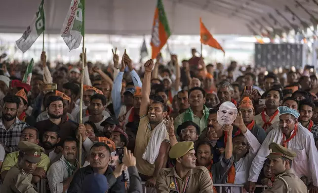 FILE- Supporters of India's ruling Bharatiya Janata Party (BJP) react as they listen to Indian Prime Minister Narendra Modi speak at an election rally in Meerut, India, March 31, 2024. (AP Photo/Altaf Qadri, File)