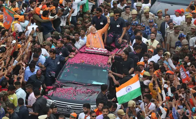 FILE - Indian Prime Minister Narendra Modi waves to a crowd while campaigning in Varanasi, India, April 25, 2019. (AP Photo/Rajesh Kumar Singh, file)