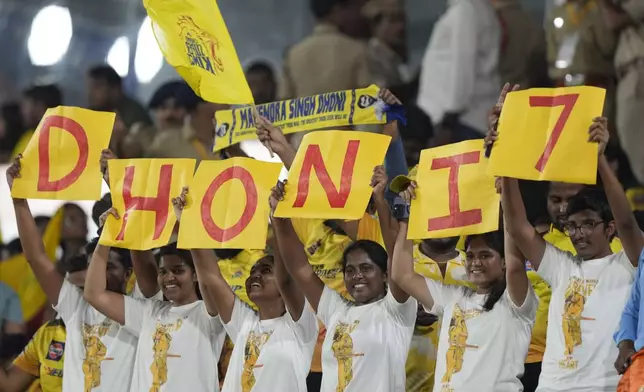 Chennai Super Kings' MS Dhoni's fans hold placards during the Indian Premier League cricket match between Sunrisers Hyderabad and Chennai Super Kings in Hyderabad, India, Friday, April 5, 2024. (AP Photo/Mahesh Kumar A.)
