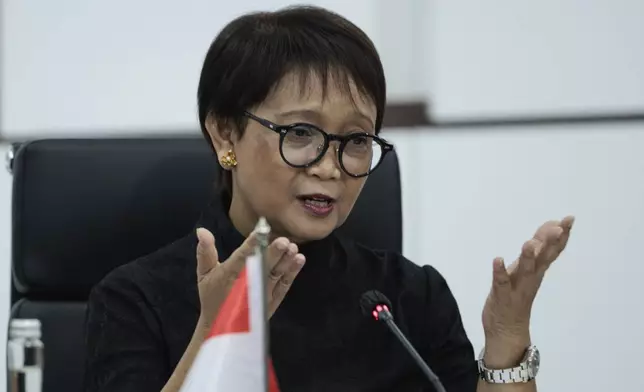 Indonesian Foreign Minister Retno Marsudi gestures as she speaks during a bilateral meeting with Chinese Foreign Minister Wang Yi in Jakarta, Indonesia, Thursday, April 18, 2024. The Chinese and Indonesian foreign ministers called for an immediate and lasting cease-fire in Gaza after a meeting in Jakarta on Thursday, condemning the humanitarian costs of the ongoing war that has killed tens of thousands of Palestinians. (Yasuyoshi Chiba/Pool Photo via AP)