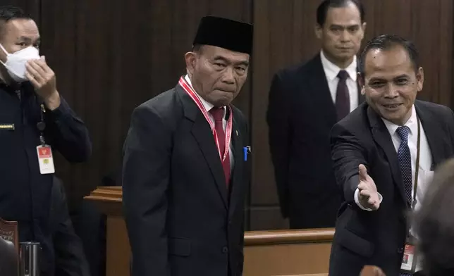 Indonesian Coordinating Minister for Human Development and Cultural Affairs Muhadjir Effendy arrives to give a statement in a hearing on the presidential election result dispute at the Constitutional Court in Jakarta, Indonesia, Friday, April 5, 2024. (AP Photo/Dita Alangkara)