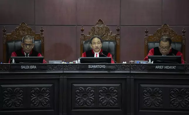 Chief Judge Suhartoyo, center, presides over the election appeal hearing at the Constitutional Court in Jakarta, Indonesia, Monday, April 22, 2024. The country's top court on Monday rejected appeals lodged by two losing presidential candidates who are demanding a revote, alleging widespread irregularities and fraud at the February polls. (AP Photo/Dita Alangkara)