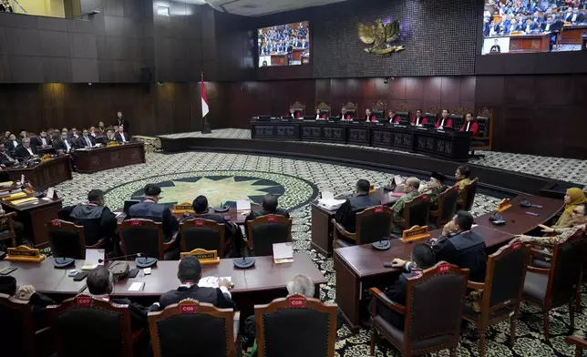 Judges preside over the election appeal hearing at the Constitutional Court in Jakarta, Indonesia, Monday, April 22, 2024. The country's top court on Monday rejected appeals lodged by two losing presidential candidates who are demanding a revote, alleging widespread irregularities and fraud at the February polls. (AP Photo/Dita Alangkara)