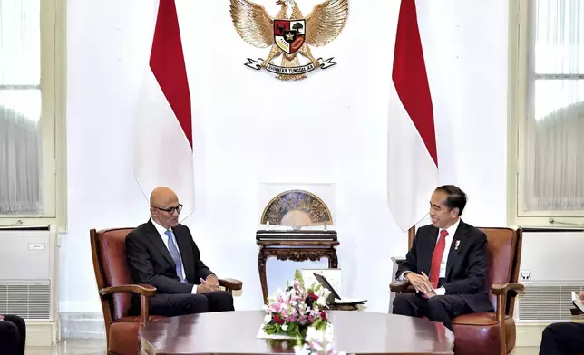 In this photo released by Indonesian Presidential Palace, Microsoft CEO Satya Nadella, left, meets with Indonesia President Joko Widodo at Merdeka palace in Jakarta, Indonesia, Tuesday, April 30, 2024. Microsoft will invest $1.7 billion over the next four years in new cloud and AI infrastructure in Indonesia, the single largest investment in Microsoft’s 29-year history in the country, said Nadella, on Tuesday. (Vico/Indonesian President Palace via AP)