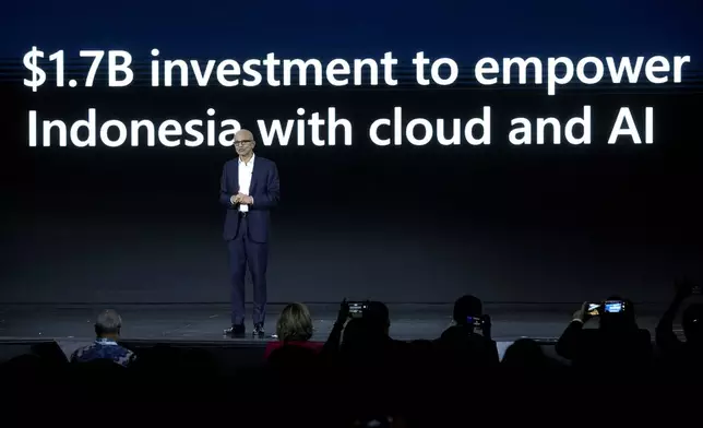 Microsoft CEO Satya Nadella speaks during an event titled "Microsoft Build: AI Day" in Jakarta, Indonesia, Tuesday, April 30, 2024. Microsoft will invest $1.7 billion over the next four years in new cloud and artificial intelligence infrastructure in Indonesia — the single largest investment in Microsoft's 29-year history in the country — Nadella said Tuesday. (AP Photo/Dita Alangkara)