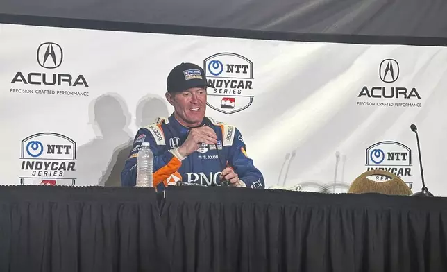 Chip Ganassi Racing driver Scott Dixon speaks during a press conference after winning the IndyCar Grand Prix of Long Beach auto race Sunday, April 21, 2024, in Long Beach, Calif. The win was the 57th of his career, moving him 10 away from A.J. Foyts all-time record. (AP Photo/Jenna Fryer)
