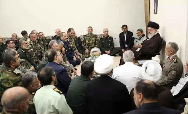 In this photo released by the official website of the office of the Iranian supreme leader, Supreme Leader Ayatollah Ali Khamenei, right, speaks in his meeting with a group of senior military leaders, in Tehran, Iran, Sunday, April 21, 2024. Iran's supreme leader on Sunday dismissed any discussion of whether Tehran's unprecedented drone-and-missile attack on Israel hit anything there, a tacit acknowledgment that despite launching a massive assault, few projectiles actually made through to their targets. (Office of the Iranian Supreme Leader via AP)