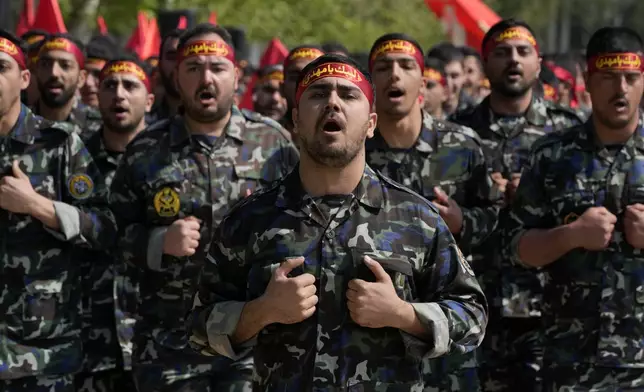 Volunteer troops of the Iranian army march during Army Day parade at a military base in northern Tehran, Iran, Wednesday, April 17, 2024. In the parade, President Raisi warned that the "tiniest invasion" by Israel would bring a "massive and harsh" response, as the region braces for potential Israeli retaliation after Iran's attack over the weekend. (AP Photo/Vahid Salemi)