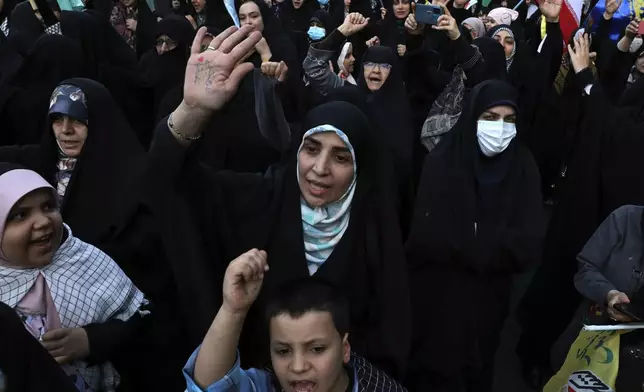 Iranian demonstrators chant slogans during a anti-Israeli gathering at the Felestin (Palestine) Sq. in Tehran, Iran, Monday, April 15, 2024. World leaders are urging Israel not to retaliate after Iran launched an attack involving hundreds of drones, ballistic missiles and cruise missiles. (AP Photo/Vahid Salemi)