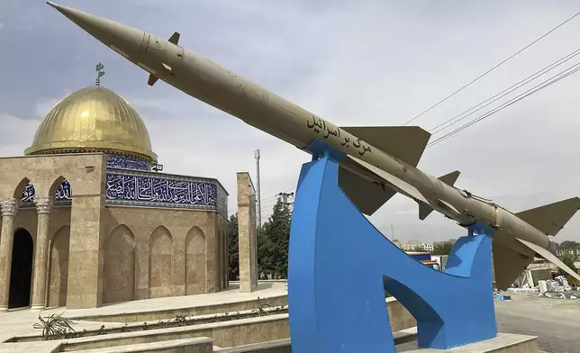 A missile is on display with a sign on it reading in Farsi: "Death to Israel" in front of a mosque in the shape of Dome of the Rock of Jerusalem at an entrance of the Quds town west of the capital Tehran, Iran, Sunday, April 21, 2024. Iran's supreme leader Ayatollah Khamenei on Sunday dismissed any discussion of whether Tehran's unprecedented drone-and-missile attack on Israel hit anything there, a tacit acknowledgment that despite launching a massive assault, few projectiles actually made through to their targets. (AP Photo/Vahid Salemi)