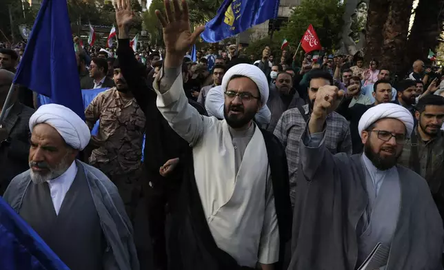 Iranian demonstrators chant slogans during their anti-Israeli gathering at the Felestin (Palestine) Sq. in Tehran, Iran, Monday, April 15, 2024. World leaders are urging Israel not to retaliate after Iran launched an attack involving hundreds of drones, ballistic missiles and cruise missiles. (AP Photo/Vahid Salemi)
