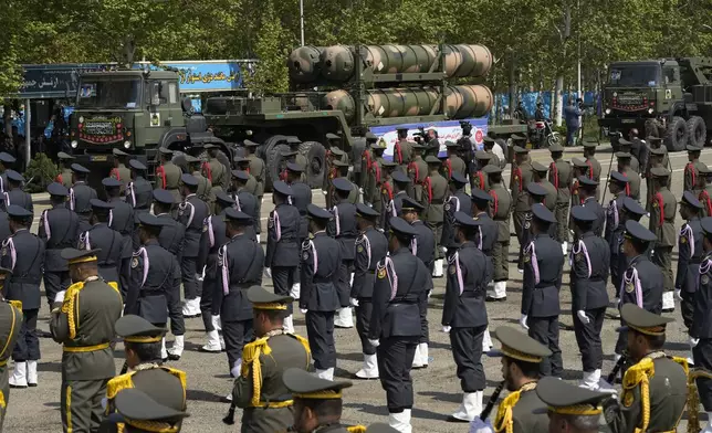 A Russian-made S-300 air defense system is carried on a truck during Army Day parade at a military base in northern Tehran, Iran, Wednesday, April 17, 2024. In the parade, President Ebrahim Raisi warned that the "tiniest invasion" by Israel would bring a "massive and harsh" response, as the region braces for potential Israeli retaliation after Iran's attack over the weekend. (AP Photo/Vahid Salemi)