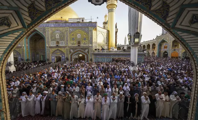 FILE - Shiites attend Eid al-Fitr prayers at Imam Ali shrine in Najaf, Iraq, Saturday, April 22, 2023, to mark the end of the holy Islamic month of Ramadan. (AP Photo/Anmar Khalil, File)
