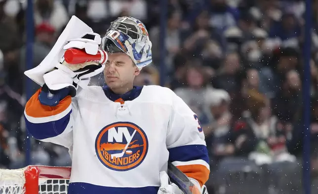 New York Islanders goaltender Ilya Sorokin sprays water onto his face during the second period of an NHL hockey game against the Columbus Blue Jackets on Thursday, April 4, 2024, in Columbus, Ohio. (AP Photo/Joe Maiorana)