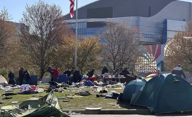 Police clear an encampment on the Northeastern University campus in Boston, early Saturday, April 27, 2024. (AP Photo/Michael Casey)