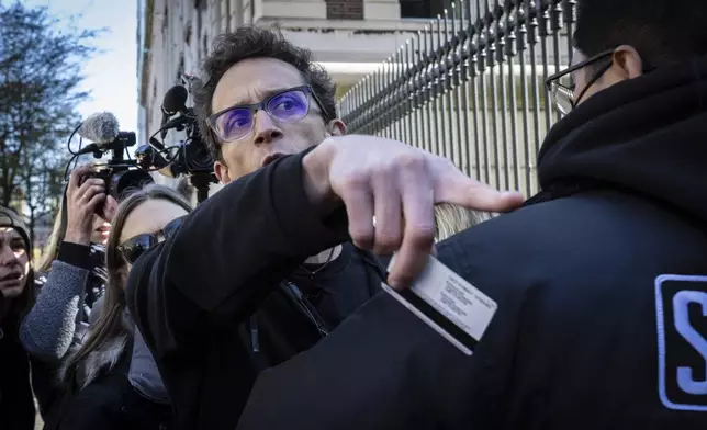 Columbia University assistant professor Shai Davidai, is denied access to the main campus after his security card was deactivated, to prevent him from accessing the lawn currently occupied by pro-Palestine student demonstrators in New York on Monday, April 22, 2024. (AP Photo/Stefan Jeremiah)