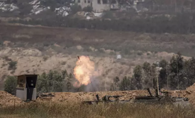 Israeli soldiers fire mortars from southern Israel towards the Gaza Strip, from a position near the Israel-Gaza border on Wednesday, April 17, 2024. (AP Photo/Ohad Zwigenberg)