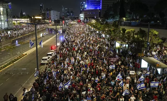 People protest against Israeli Prime Minister Benjamin Netanyahu's government and call for the release of hostages held in the Gaza Strip by the Hamas militant group in Tel Aviv, Israel, Saturday, April 27, 2024. (AP Photo/Ohad Zwigenberg)