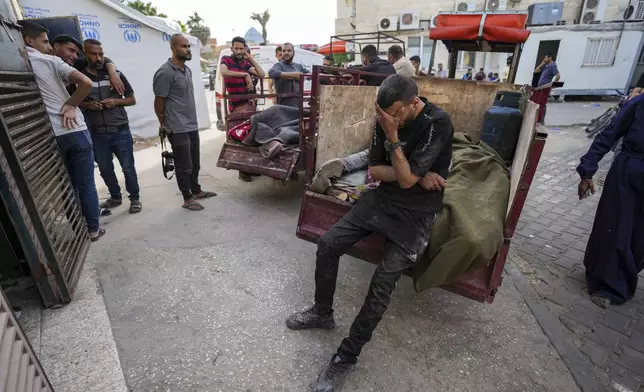Palestinians mourn their relatives killed in the Israeli bombardment of the Gaza Strip at the Al Aqsa hospital in Deir al Balah, Thursday, April 25, 2024. (AP Photo/Abdel Kareem Hana)