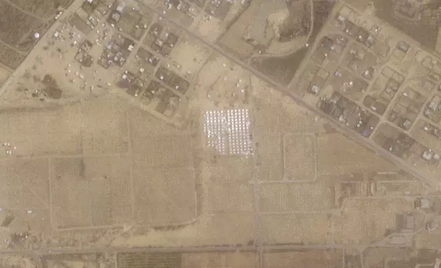 This satellite image from Planet Labs PBC shows tents being constructed near Khan Younis in the Gaza Strip on Thursday, April 18, 2024. Satellite photos analyzed Tuesday, April 23, 2024 by The Associated Press appear to show a new compound of tents being built near Khan Younis in the Gaza Strip as the Israeli military continues to signal it plans an offensive targeting the city of Rafah. (Planet Labs PBC via AP)