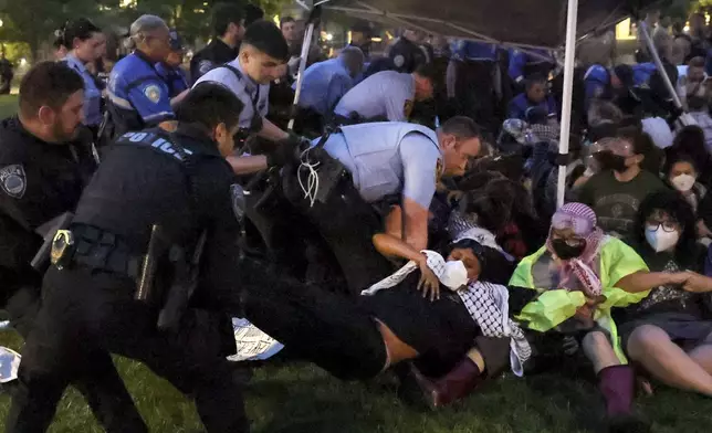 Police arrest pro-Palestinian protesters attempting to camp on Washington University's campus, Saturday, April 27, 2024, in St. Louis, Mo. (Christine Tannous/St. Louis Post-Dispatch via AP)