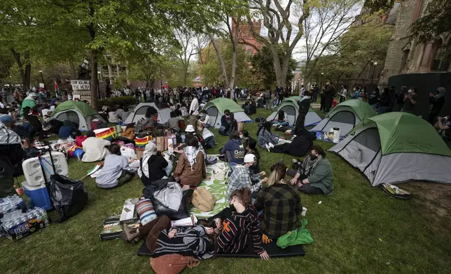 People take part in a pro-Palestinian protest on Penn's campus in Philadelphia on Thursday, April 25, 2024. (Elizabeth Robertson/The Philadelphia Inquirer via AP)