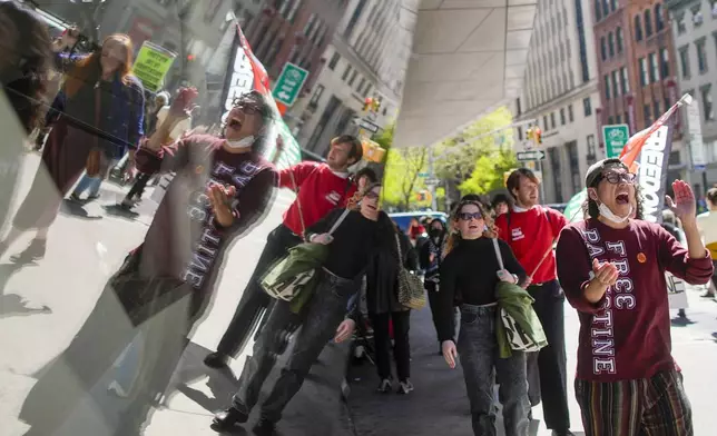 The New School students and pro-Palestinian supporters rally outside The New School University Center building, Monday, April 22, 2024, in New York. (AP Photo/Mary Altaffer)