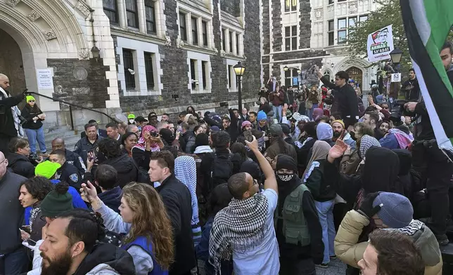 Students at the City College of New York protest the Israel-Hamas war on the campus in the Harlem neighborhood of New York, Thursday, April 25, 2024. (AP Photo/Jake Offenhartz)