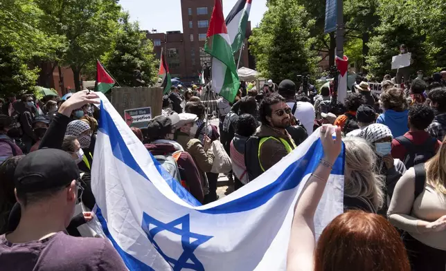 Israel supporters show up at George Washington University where students protest, during a pro-Palestinian protest over the Israel-Hamas war, Friday, April 26, 2024, in Washington. (AP Photo/Jose Luis Magana)