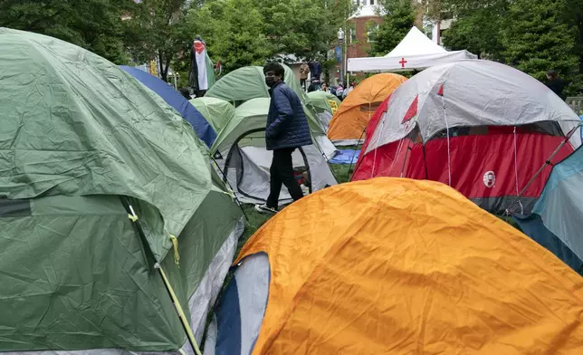George Washington University students set up tents on the campus during a pro-Palestinian protests over the Israel-Hamas war on Thursday, April 25, 2024, in Washington. (AP Photo/Jose Luis Magana)