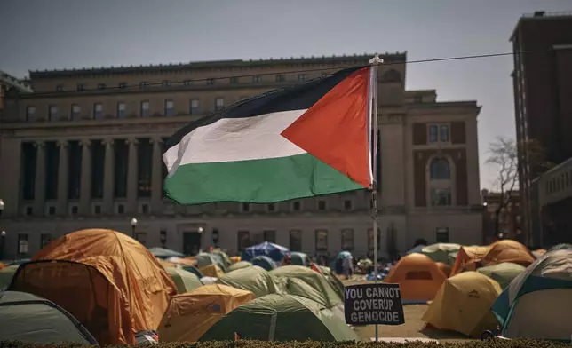 A Palestinian flag flutters in the wind during a pro-Palestinian encampment, advocating for financial disclosure and divestment from all companies tied to Israel and calling for a permanent cease-fire in Gaza, inside Columbia University Campus on Sunday, April 28, 2024, in New York. (AP Photo/Andres Kudacki)