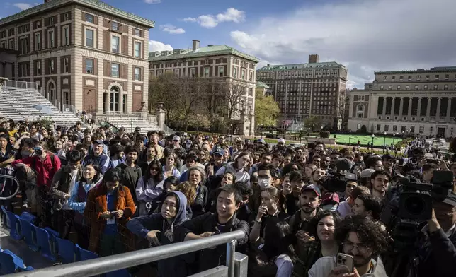 Students and press look on as Speaker of the House Mike Johnson (R-LA) speaks to the media on the Low Library steps on Columbia University's campus in New York on Wednesday April 24, 2024. (AP Photo/Stefan Jeremiah)