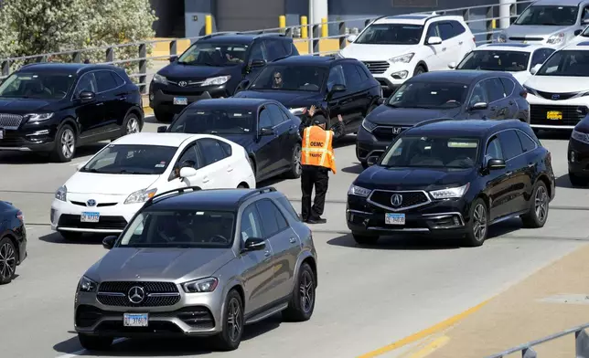 Heavy traffic is seen at O'Hare International Airport in Chicago, Monday, April 15, 2024. Pro-Palestinian demonstrators blocked a freeway leading to three Chicago O'Hare International Airport terminals Monday morning, temporarily stopping vehicle traffic into one of the nation's busiest airports and causing headaches for travelers. (AP Photo/Nam Y. Huh)
