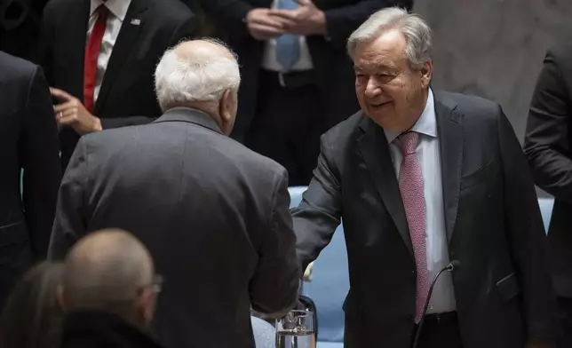 Palestinian Ambassador to the United Nations Riyad Mansour, left, and United Nations Secretary-General Antonio Guterres speak before a Security Council meeting at the United Nations headquarters, Thursday, April 18, 2024. (AP Photo/Yuki Iwamura)