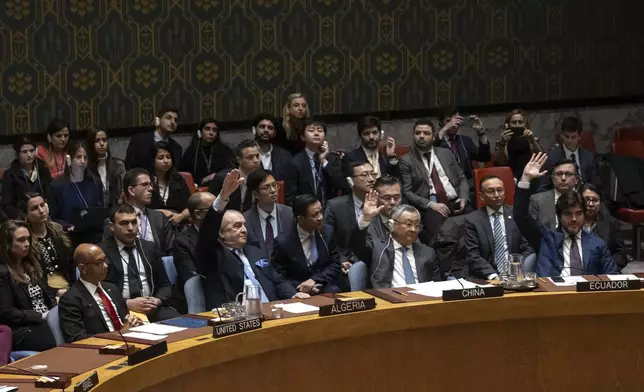 Representatives of member countries take votes during a Security Council meeting at United Nations headquarters, Thursday, April 18, 2024. (AP Photo/Yuki Iwamura)