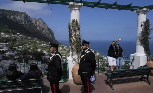 Italian Carabinieri paramilitary policemen patrol in downtown Capri, Wednesday, April 17, 2024. Group of Seven foreign ministers are meeting on the Italian resort island of Capri, with soaring tensions in the Mideast and Russia's continuing war in Ukraine topping the agenda. The meeting runs April 17-19. (AP Photo/Gregorio Borgia)