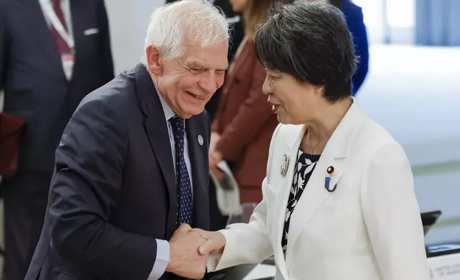European Union foreign policy chief Josep Borrell, left, and Japanese Foreign Minister Yoko Kamikawa shake hands at a meeting on the second day of a G7 foreign ministers meeting on Capri island, Italy, Thursday April 18, 2024. (Remo Casilli/Pool via AP)