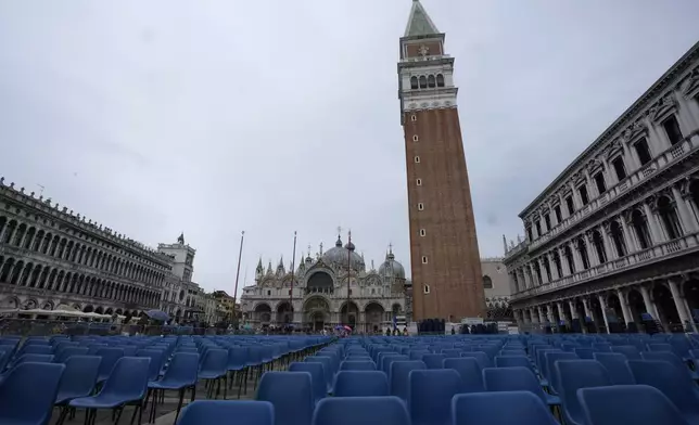 A view of seats placed ahead of Pope Francis' visit on Sunday in St. Mark Square, in Venice, Italy, Saturday, April 27, 2024. (AP Photo/Antonio Calanni)
