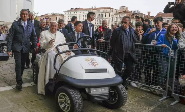 Pope Francis arrives in front of the Church of the Salute to meet with youths in Venice, Italy, Sunday, April 28, 2024. The Pontiff arrived for his first-ever visit to the lagoon town including the Vatican pavilion at the 60th Biennal of Arts. (AP Photo/Alessandra Tarantino)