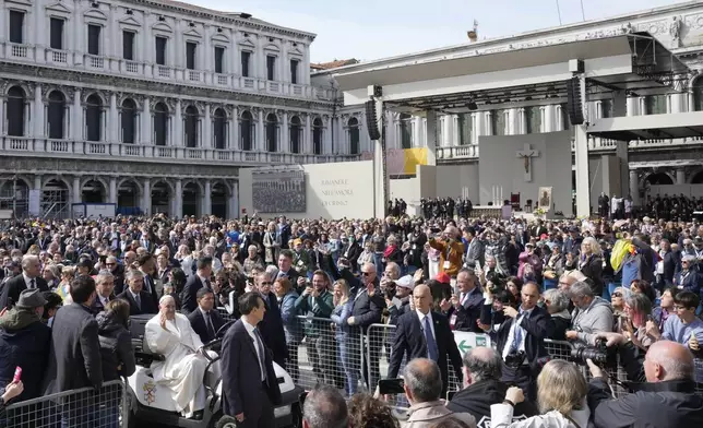 Pope Francis arrives in St. Mark's Square to celebrate a mass in Venice, Italy, Sunday, April 28, 2024. The Pontiff arrived for his first-ever visit to the lagoon town including the Vatican pavilion at the 60th Biennal of Arts. (AP Photo/Antonio Calanni)
