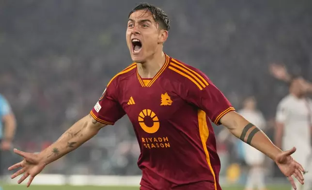 Roma's Paulo Dybala celebrates after scoring his team's secnd goal during the Europa League quarterfinal second leg soccer match between Roma and AC Milan, at Rome's Olympic Stadium, Thursday, April 18, 2024. (AP Photo/Andrew Medichini)