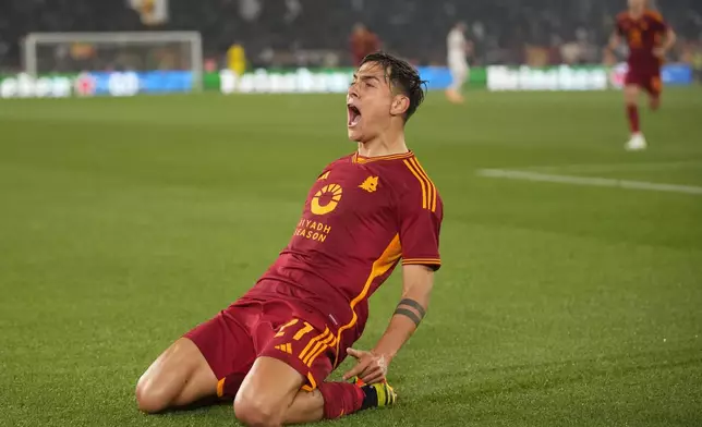 Roma's Paulo Dybala celebrates after scoring his team's secnd goal during the Europa League quarterfinal second leg soccer match between Roma and AC Milan, at Rome's Olympic Stadium, Thursday, April 18, 2024. (AP Photo/Andrew Medichini)
