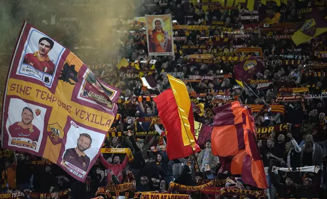Fans of Roma cheer for their team prior to the start of the Europa League quarterfinal second leg soccer match between Roma and AC Milan, at Rome's Olympic Stadium, Thursday, April 18, 2024. (AP Photo/Andrew Medichini)