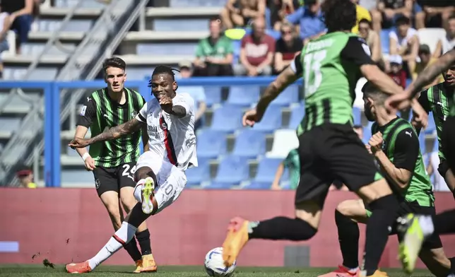 Milan's Rafael Leao, second left, scores their side's first goal of the game during the Serie A soccer match between Sassuolo and Milan at Mapei Stadium in Sassuolo, Italy, Sunday April 14, 2024 (Massimo Paolone/LaPresse)