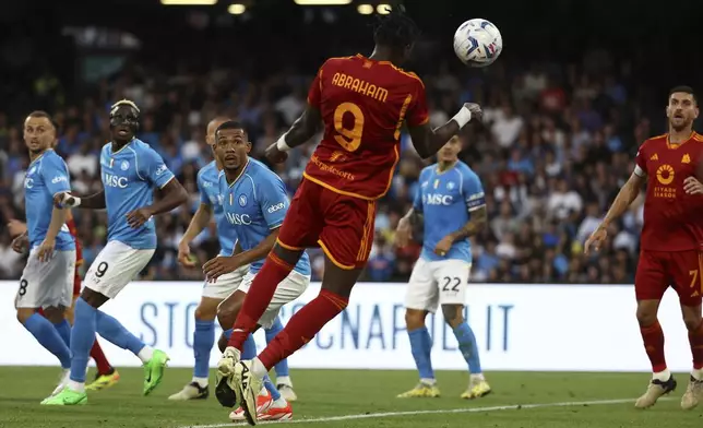Roma's Tammy Abraham scores his side's second and equalizing goal during a Serie A soccer match between Napoli and Roma at the Diego Armando Maradona Stadium in Naples, Italy, Sunday, April 28, 2024. (Alessandro Garofalo/LaPresse via AP)