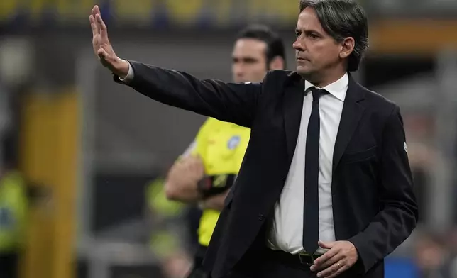 Inter Milan's head coach Simone Inzaghi gestures during the Italian Serie A soccer match between Inter Milan and Cagliari at the San Siro stadium in Milan, Italy, Sunday, April 14, 2024. (AP Photo/Antonio Calanni)